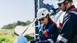 © NewSaetiew - Professional wind turbine engineers preparing and inspecting equipment for installation and maintenance at a renewable energy site, teamwork, clean power, and sustainable technology.