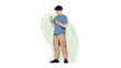 © Arjuna - Young man standing outdoors engrossed in his smartphone using casual attire and background greenery