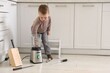 © New Africa - Child safety at home. Little boy playing with kitchen supplies indoors, space for text
