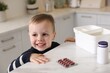 © New Africa - Child safety at home. Little boy playing with pills at table in kitchen