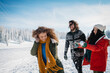 © Halfpoint - Group of friends enjoying winter time in snowy nature.