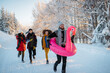 © Halfpoint - Group of friends enjoying winter time in snowy nature.