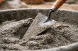 © Andrii  - Construction Trowel Mixing Fresh Cement Concrete in Building Site Container