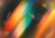 © DesignSells - Abstract cosmic light streaks and vibrant color gradients swirl across a grainy dark background, evoking dynamic motion, energy, and artistic flair for modern design projects