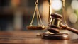 © JT Studio - A close-up of a gavel and scales of justice, symbolizing law, order, and legal proceedings in a courtroom setting.
