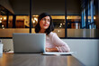 © peopleimages.com - Thinking, business and woman with laptop in office for copywriting, planning and ideas for headline. Female person, vision and pc for research, employee reflection and problem solving for publication