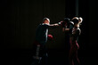 © Westend61 - Boxing practice in gym with red gloves showing strength and precision