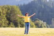 © Ktn - Young caucasian teen male celebrating outdoors in nature with arms outstretched