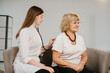 © dsheremeta - Doctor examining senior woman with stethoscope in clinic