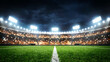 © BAPJAN IT - Football stadium illuminated at night with bright spotlights and filled spectator stands