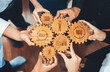 © InfiniteFlow - Diverse hands holding wooden gears with Agile symbols, showcasing teamwork, collaboration, and strategic development in a modern business environment.. Amity