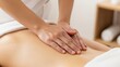 © PurArts Studio - Closeup of hands giving a relaxing back massage to a person lying down in a spa setting
