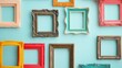 © David - Assortment of colorful vintage picture frames with ornate baroque detailing randomly displayed against a bright turquoise wall creating an appealing artistic empty space background for mockups