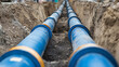 © A2Z AI  - Two blue parallel pipes being installed underground in a trench, ensuring a seamless water system for the future of urban development. Strategic infrastructure.