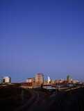 The downtown Raleigh skyline and railroad tracks at sunset