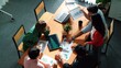 © InfiniteFlow - Top view of project manager present financial graph to investors at meeting. Professional marketing team brainstorming financial idea while looking at financial statistic from laptop. Convocation.