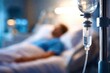 © SweetCommercial - A man is hooked up to a IV drip in a hospital bed