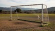 © Donnangelo - An old soccer goal standing alone in a rural field with mountains in the background.