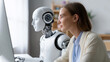 © Curioso.Photography - Humanoid robot working together with a woman in a modern home office environment.