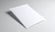 © andre - Clean blank white folded paper brochure or leaflet mockup template on a minimalist grey background. Ideal for professional design concepts, branding visuals, and marketing with ample copy space
