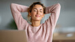 © Sergey - Relaxed person enjoying a work break at desk for enhanced wellness and productivity