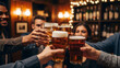 © rahatpix - Friends cheering with beer glasses in a dimly lit bar