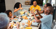 © Nexa - Happy Multi-Generational Black Family Enjoying Breakfast Together at Home