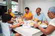 © Nexa - Happy multi-generational African American family enjoying a healthy breakfast together at home.