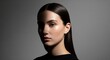 © PrabuanaAndika - Dramatic studio beauty portrait of a woman highlighting glossy skin and smooth dark hair.