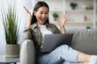 © Prostock-studio - Happy asian lady screaming and raising hands up, using brand new laptop, young korean woman student got positive answer from university, checking exam, test results online, copy space