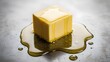 © Franklin - Honey melting over a fresh butter cube on a metallic surface for gourmet food concept