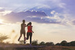 © Panumas - Silhouette of young couple running together on road across the bridge. Couple, fit runners fitness runners during outdoor workout