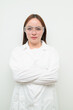 © Ranta Images - Portrait of Asian female research scientist against white background with arms crossed