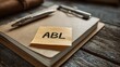 © Popelniushka - Visual Representation of Asset Based Lending: A Notebook, Pen, and Clipboard with ABL Note