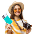 © Damir Khabirov - Happy female tourist with camera holding passport and tickets ready for vacation travel departure