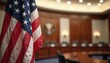 © Pete - US flag waves gently in focus before blurry oval hearing room with wooden paneling and official seal. Symbol of American democracy and government proceedings.