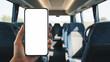 © MD Rashedul Islam - Hand holding mobile phone with blank white screen mockup for app design presentation inside a passenger bus coach during a travel journey or daily commute using digital wireless internet.