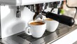 © Akunlakulah - Espresso machine brewing coffee into white mugs