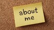 © Neon Stock - Yellow sticky note with handwriting 'about me' pinned on a cork notice board