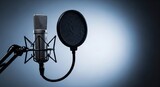 Professional condenser studio microphone with pop filter on a boom stand for podcasting and broadcasting