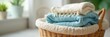© Jakkrit - Neatly folded laundry sits in a wicker basket, ready to be put away Soft, textured fabrics in a calming, organized scene Perfect for home organization, cleaning, or lifestyle imagery , beige, green