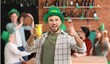 © Pixel-Shot - Young man in green hat and with mug of beer celebrating St. Patrick's Day in pub