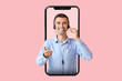 © Pixel-Shot - Answering male consultant of call center with headset on pink background