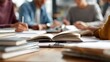 © Aflan - photorealistic HD photo of people studying together at table books and notebooks visible natural indoor lighting equal opportunity and education theme