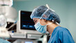 © wedmoments.stock - Female surgeon in blue scrubs and surgical mask, focused on procedure in operating room, with advanced medical equipment and monitors in background, showcasing precision and care