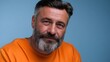 © Benjamin - Clean studio portrait of a mature man with gray hair and white beard, natural skin texture and wrinkles, calm expression, soft lighting, blue background, modern and realistic look