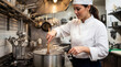 © Valentina Sorokina - Young female chef cooking in restaurant kitchen and stirring pot