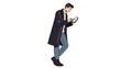 © Elsha - Young man standing outdoors engrossed in his smartphone while wearing casual clothing and a long