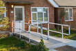 © Nimur - Wheelchair Ramp on door for disabled people to access