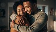© Morvana - Young Black Couple Embracing Warmly Indoors at Home.
